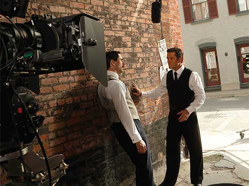 Two men talking while on set of Murdoch